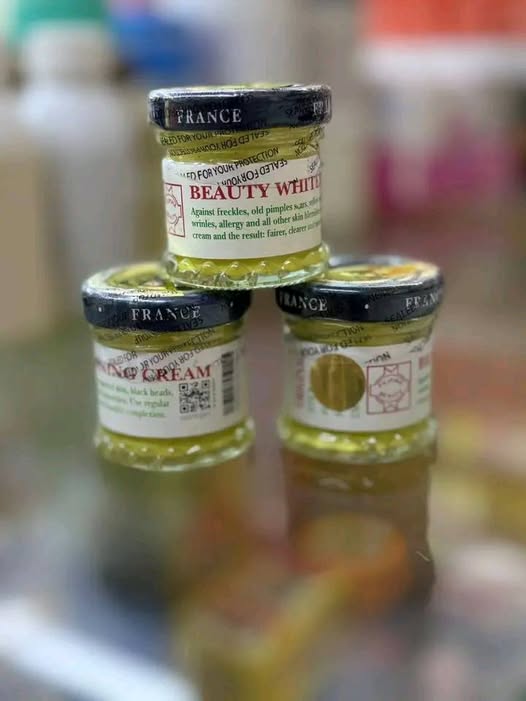 Three jars of Dalfour French Whitening Cream, showcasing the elegant packaging and brightening features for skin enhancement