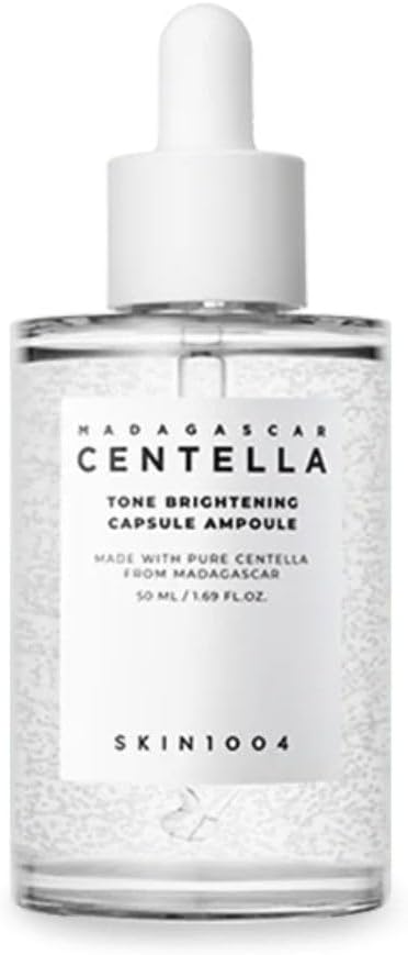 Skin1004 Centella ampoule in a clear dropper bottle with a white label, promoting skin hydration and brightness.