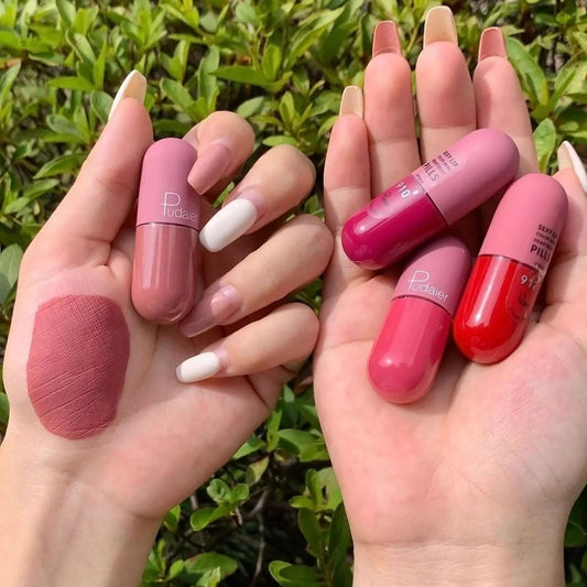 Set of mini capsule matte lipsticks in pink, red, and nude shades held in hands, perfect to buy mini lipstick online UAE