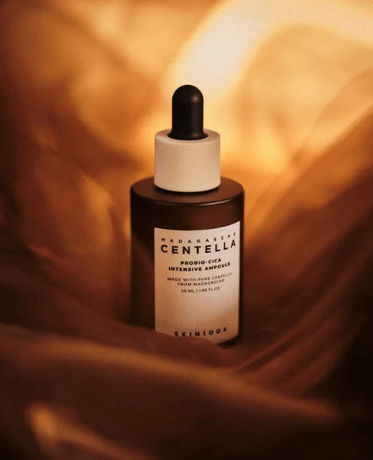SKIN1004 Centella ampoule for glowing skin in a 50ml dropper bottle with a soft-focus background.